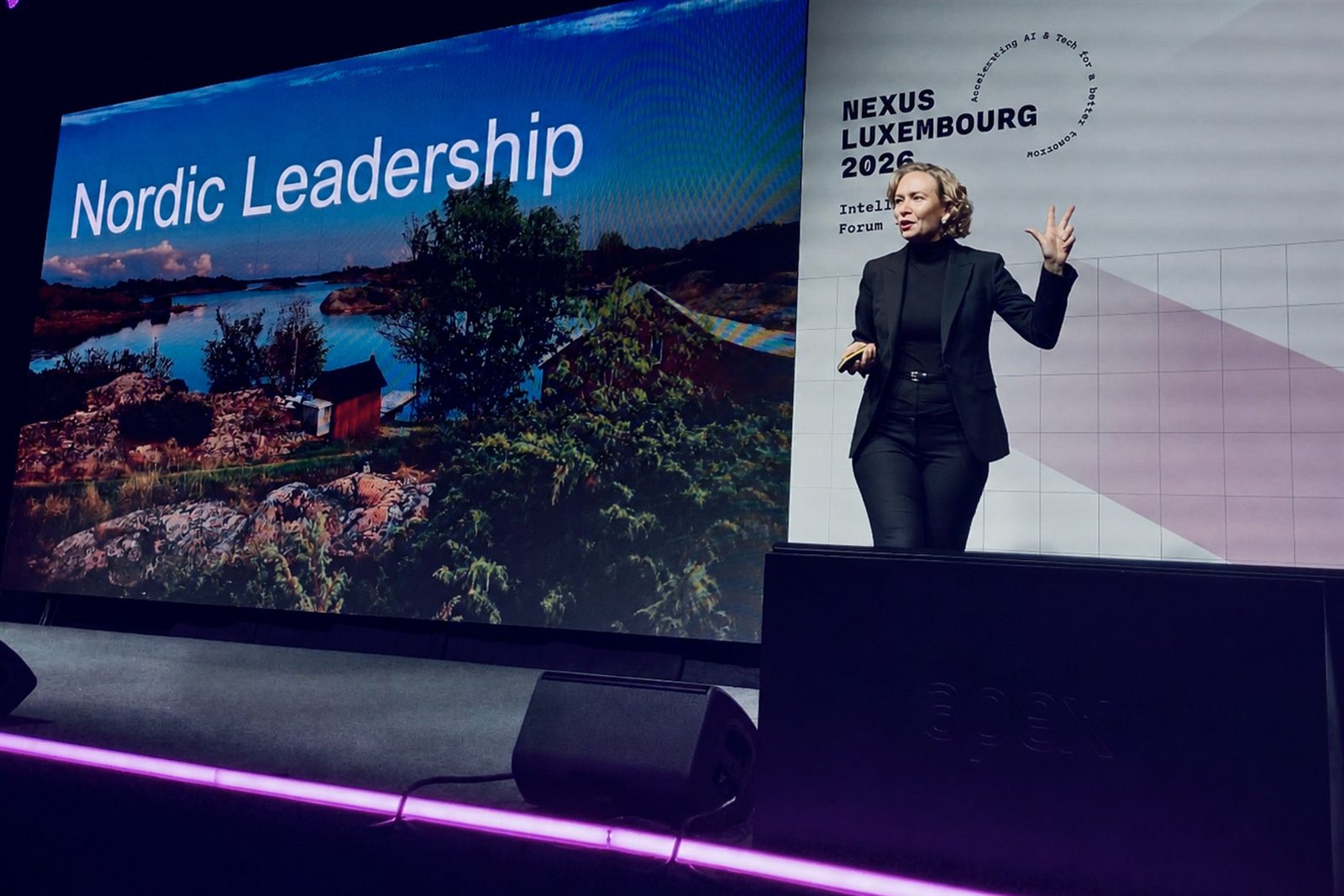 Tarja Stephens speaking on stage at Nexus Luxembourg.